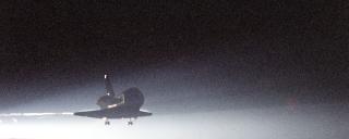 Shuttle Columbia glides in for night landing, STS-93